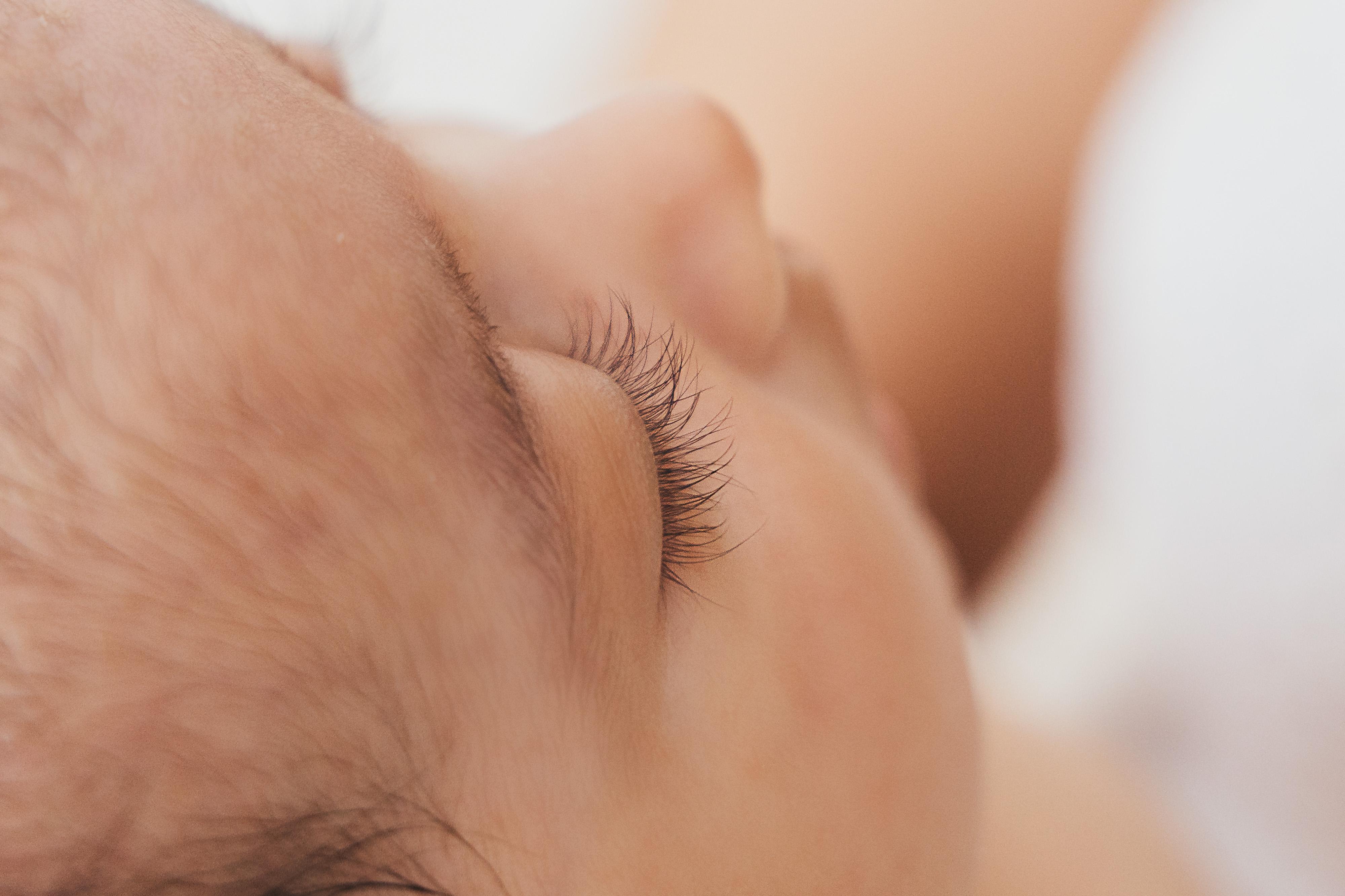 Newborn baby sleeping peacefully during a calm, unhurried session at Oana Maria Photography Rugby